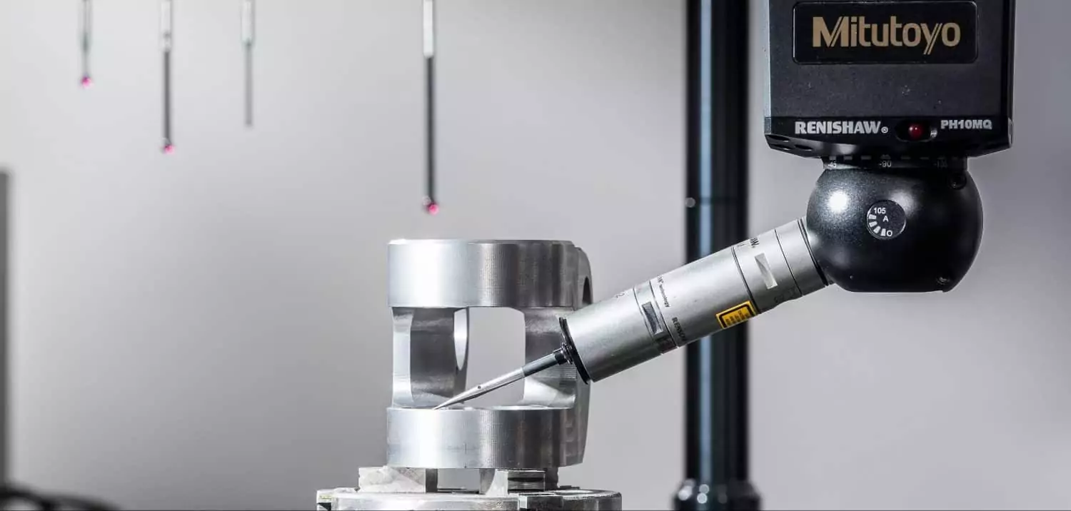 close up of a renishaw PH10MQ coordinate measuring machine (CMM) and high precision aluminium part